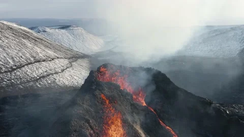Active volcano emitting carbon dioxide while spewing molten magma Stock Footage 151731159