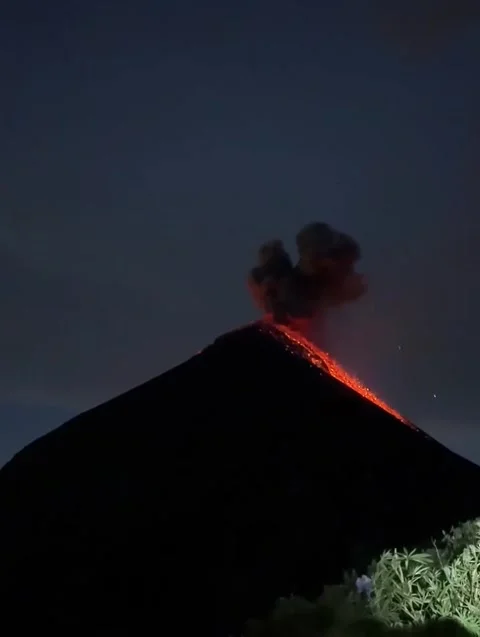 Active Volcano Erupting at Night Above Clouds Stock Footage 341267275
