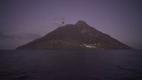 Active volcano eruption on island Stromboli, Italy viewed at night Stock-Footage 120047425