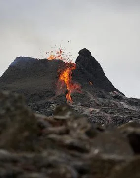 Active volcano exploding with igneous lava 스톡 사진