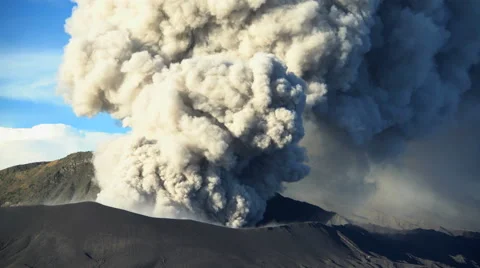 Active volcano Mt Bromo erupting smoke Java Indonesia South East Asia Stock Footage