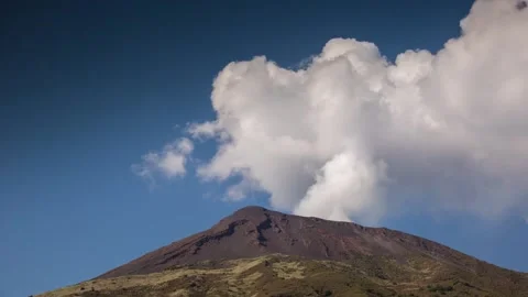 Active Volcano Summit Crater Emitting Thick White Smoke Clouds Blue Sky Day Video stock 322181358