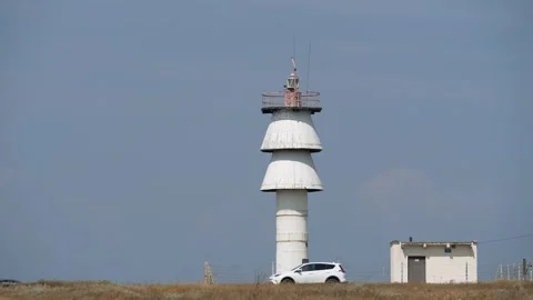 An active white Marine lighthouse on the steppe coast. Stock Footage 164781476