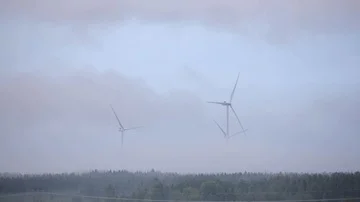 Active windmills on a misty weather Stock Footage 86011014