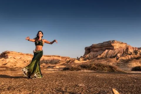 Active woman dancing on plain of the Namibe Desert. Africa. Angola. Foto stock