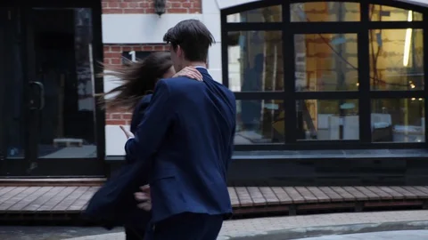 Actively Dancing Meme Moves on a Street next to an Urban Concrete Wall. Video stock 129638479