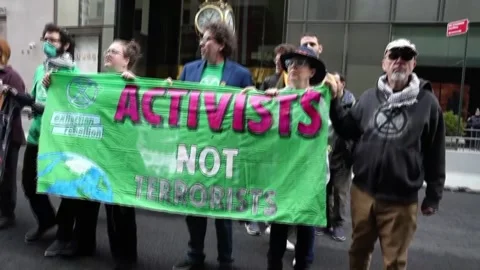 Activists arrested during Earth Day protest in New York, Nueva York, US - 22 Apr Stock Footage 333284124