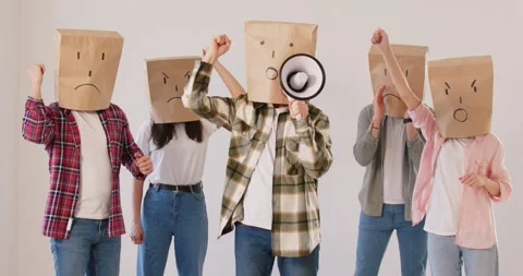 Activists With Negative Emotions Masks Protesting And Giving Speech Stock Footage 288430882