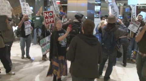 Activists protest the T.P.P. inside a corporate office in Washington.   Stock Footage 57979639