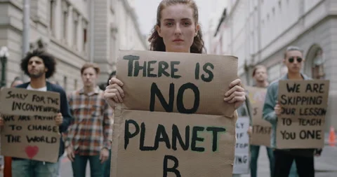 Activists protesting on street against climate change Stock Footage 130756169