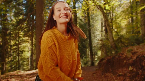 Activities for Happy Fall. Pretty young woman walking in park, dancing and Stock Footage 204049941