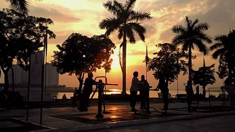 The activities of phnom penh residents when the sunrise arrives Stock Footage 148309065
