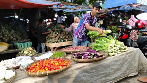 Activities in traditional markets between traders and buyers in Pelabuhanratu Stock Footage 236967440