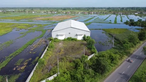 Activities in the warehouse area include loading industrial goods into tran.. 動画素材 312215356