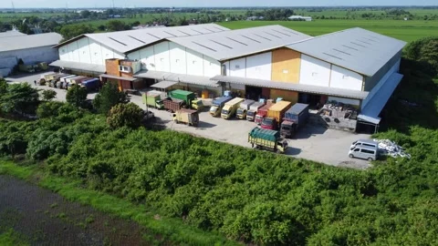 Activities in the warehouse area include loading industrial goods into tran.. 動画素材 312215682