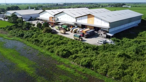 Activities in the warehouse area include loading industrial goods into tran.. 動画素材 312215724