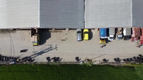 Activities in the warehouse area include loading industrial goods into tran.. 動画素材 312215816