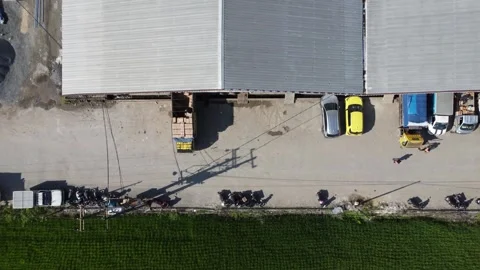 Activities in the warehouse area include loading industrial goods into tran.. 動画素材 312215826