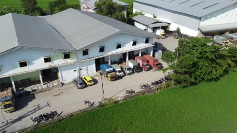 Activities in the warehouse area include loading industrial goods into tran.. 動画素材 312215880