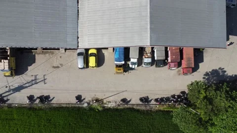 Activities in the warehouse area include loading industrial goods into tran.. 動画素材 312215907