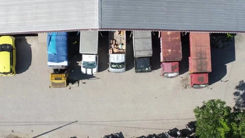 Activities in the warehouse area include loading industrial goods into tran.. 動画素材 312215928