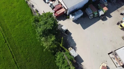 Activities in the warehouse area include loading industrial goods into tran.. 動画素材 312216066