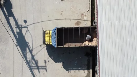 Activities in the warehouse area include loading industrial goods into tran.. 動画素材 312216145