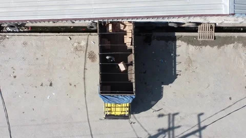 Activities in the warehouse area include loading industrial goods into tran.. 動画素材 312216146
