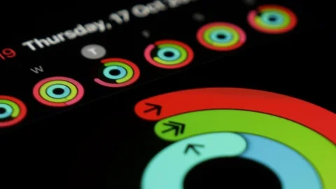 Activity app on the iPhone, macro shot. Opening the app and chacking the Vídeos de archivo 123890742