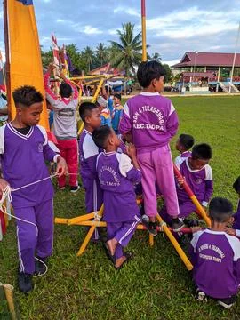 Activity of boy scouts tying ropes on scout sticks Stock Photos
