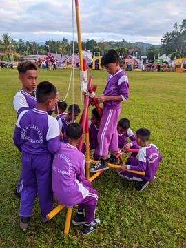 Activity of boy scouts tying ropes on scout sticks Stock Photos