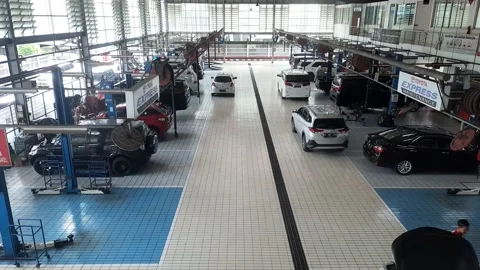 Activity in a car workshop building Stock Footage 218788920