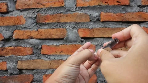 Activity of cutting long nails with a nail clipper Stock Footage 321503986