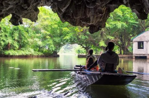 Activity downstream on boat with vietnamese using foot paddle in Ngo Dong riv Stock Photos