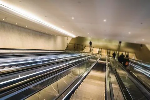 Activity on escalator in the station Stock Photos