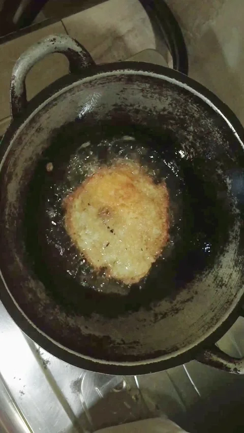 Activity of frying fried eggs in the kitchen Stock Footage 233597859