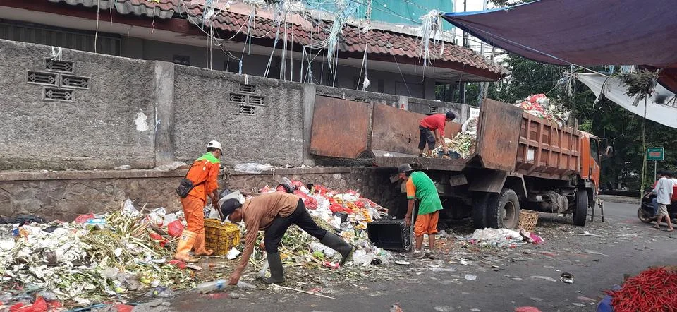 Activity garbage workers, while transporting piles of garbage truck at Bekasi Stock Photos