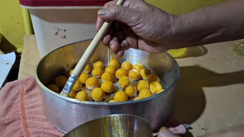 Activity of giving color to pineapple cake with egg yolk Stock Footage 259599286
