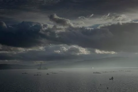 Activity in Indonesian oceans with dramatic clouds. Image contain grain and n Foto stock