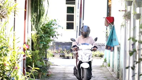 The activity of a mother riding an automatic white Stock Footage 237973156