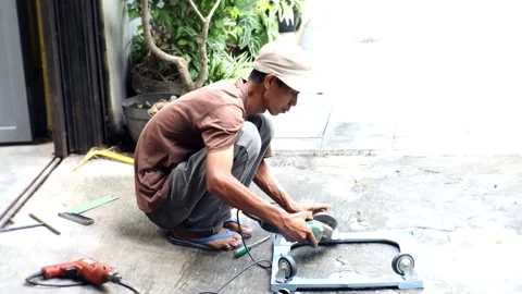 The activity of a person cutting iron with a machine Stock Footage 238648638