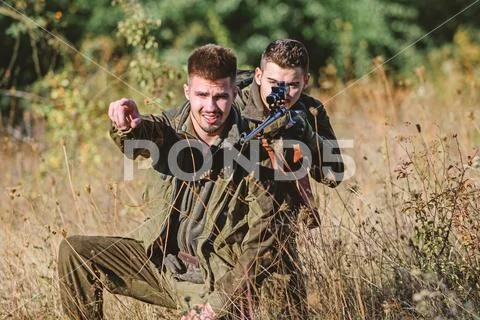 Activity for real men concept. Hunters with rifles in nature environment Stock Photos