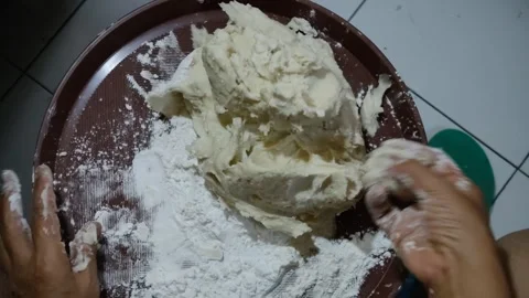 The activity of someone's hands forming flour as desired Stock Footage 276587532