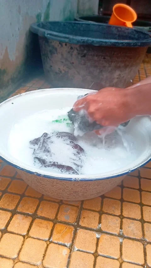 The activity of washing clothes manually using hands Stock Footage 281314798