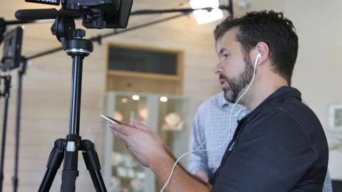 Actor and filmmaker are checking teleprompter Stock Footage 131549778