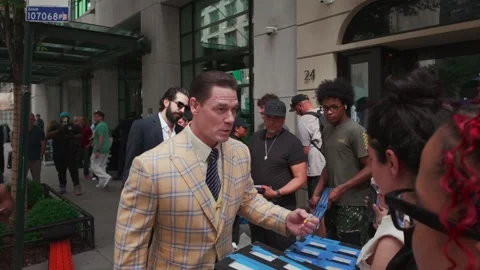 Actor and professional wrestler John Cena signs autographs and poses for photos Stock Footage 338150418