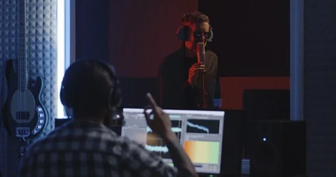 Actor doing voice over in sound studio Stock Footage 112778626