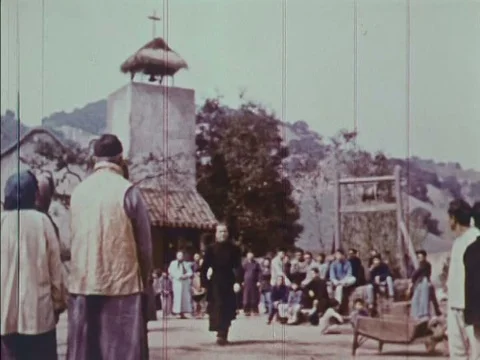 Actor Humphrey Bogart, masquerading as a priest, and actor Charlton Heston, Stock Footage 79468392