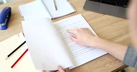 Actor leafing through script for play at table closeup 4k movie slow motion Stock Footage 235674088
