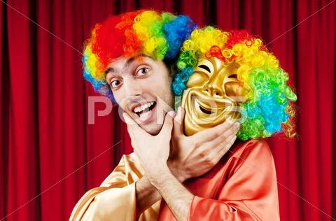 Actor with maks in a funny theater concept Stock Photos